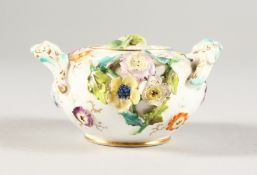 A MINIATURE COALPORT FLOWER ENCRUSTED TWO-HANDLED SUCRIER AND COVER. 3ins diameter.
