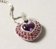 A 14CT WHITE GOLD, AMETHYST AND DIAMOND PENDANT.