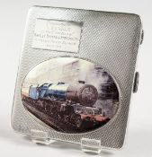 AN ENGINE TURNED SILVER CIGARETTE CASE with an oval of a train. Birmingham 1950.