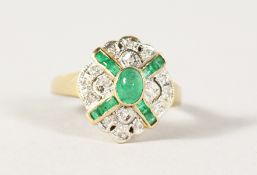 A 14CT GOLD, EMERALD AND DIAMOND RING.