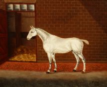 G. Phillips (Early 20th century) English school, A white horse outside a stable, oil on canvas,