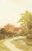 George Oyston (1861-1937) British, figure in a pathway before cottages, watercolour, signed and