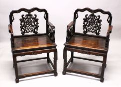 A PAIR OF 19TH CENTURY HEAVY QUALITY CHINESE CARVED HARDWOOD ARM CHAIRS, each chair with carved back