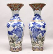 A LARGE PAIR OF JAPANESE MEIJI PERIOD BLUE AND WHITE PORCELAIN IMARI VASES, the body of the vases