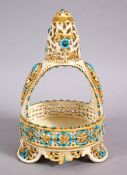 A ISLAMIC ZSLONAY OPENWORK PORCELAIN FORMED CASKET, with turquoise and gilded decoration, 20cm x