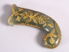 A 19TH / 20TH CENTURY CARVED JADE MUGHAL DAGGER HANDLE - with carved and gilded motif decoration,