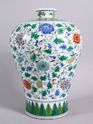 A CHINESE DOUCAI DECORATED PORCELAIN MEIPING VASE, decorated with formal scrolling lotus, and lappet