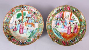 A PAIR OF 19TH CENTURY CHINESE CANTON FAMILLE ROSE PORCELAIN DEEP PLATES, each with scenes of