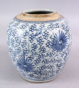 AN 18TH CENTURY CHINESE BLUE & WHITE PORCELAIN JAR, decorated with stylizes floral display, 18cm