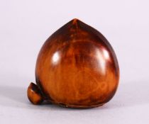 A JAPANESE MEIJI PERIOD CARVED BOXWOOD NETSUKE OF TWO CHESTNUTS, the himotoshi formed to the base,