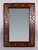 A 19TH CENTURY ISLAMIC SPANISH INLAID WOOD & MOTHER OF PEARL MIRROR- the frame inlaid with exotic