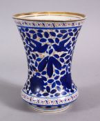 A ISLAMIC QAJAR BLUE & WHITE PORCELAIN BEAKER / VASE, with blue floral decoration and gilt