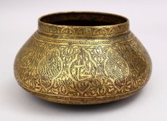 A GOOD 19TH CENTURY DAMASCUS BRASS CARVED BOWL, the bowl carved with formal floral motif, 25cm.