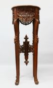 A LARGE 19TH / 20TH CENTURY ISLAMIC CARVED HARDWOOD CALLIGRAPHIC TABLE STAND, with carved frieze