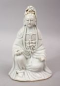 A 19TH CENTURY CHINESE BLANC DE CHINE PORCELAIN FIGURE OF GUANYIN, in a seated position holding a