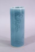 A CHINESE BLUE GLAZED SCRAFFITO PORCELAIN BRUSH WASH / BITONG - carved with scenes of stylized cloud