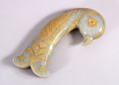 A 19TH / 20TH CENTURY CARVED JADE MUGHAL DAGGER HANDLE - in the form of a parrot, with gilded