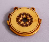 A JAPANESE MEIJI PERIOD CARVED IVORY NETSUKE - TEMPLE BELL , of circular form of a temple bell or