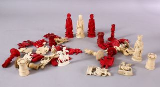 A 19TH CENTURY CHINESE CARVED & STAINED IVORY CHESS SET, comprising 16 pieces of each colour, with