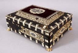 A 19TH CENTURY ISLAMIC ANGLO INDIAN VIZAGAPATAM IVORY AND HORN LIDDED BOX, with carved icvory panels