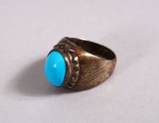 A 19TH CENTURY ISLAMIC SILVER AND TURQUOISE RING, 2.5cm high.