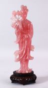 A LARGE CHINESE CARVED ROSE QUARTZ FIGURE OF GUANYIN, stood holding a bouquet of flora, on its