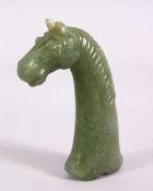 A GOOD ISLAMIC MUGHAL CARVED JADE HORSE HEAD DAGGER HANDLE, carved with a horses head, 11.5cm.
