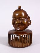 A CHINESE BRONZE CHILDRENS RATTLE OF BUDDHA, the top with a mask of buddha, the cage with balls to