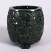 A CHINESE CARVED SPINACH JADE INCENSE BURNER, carved with dragons, upon three lion mask feet, 8cm
