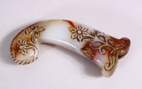 A 19TH / 20TH CENTURY CARVED JADE MUGHAL DAGGER HANDLE - carved with floral decoration, 13cm
