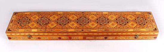 A FINE QUALITY 19TH CENTURY DAMASCUS MULTI INLAID EXOTIC WOOD SWORD / SCIMITAR BOX, inlaid with an
