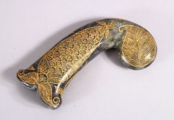 A 19TH / 20TH CENTURY CARVED JADE MUGHAL DAGGER HANDLE - with carved and gilded motif decoration,