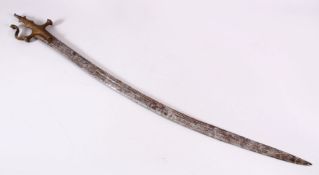 A 19TH CENTURY ISLAMIC INDIAN TULWAR SWORD, the hilt with carved floral decoration, 95cm