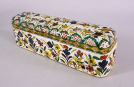 AN OTTOMAN KUTAHYA POTTERY PEN BOX, decorated with floral motif and borders, 27cm wide x 7cm wide