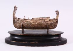 A CHINESE 19TH CENTURY WHITE METAL FILIGREE MODEL OF A JUNK - with a fitted wooden base, the junk