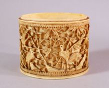 A JAPANESE MEIJI PERIOD CARVED IVORY SECTION, carved with cranes and birds amongst bamboo, 8.5cm