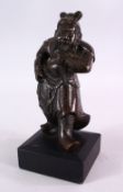 A 19TH CENTURY CHINESE BRONZE FIGURE OF GUANDI - in a striding pose with a wooden base, 22cm x 12cm