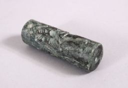 A SUMERIAN STYLE CYLINDER ROLLING SEAL, with intaglio style decoration, 6cm