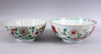 TWO 18TH CENTURY CHINESE PORCELAIN FAMILLE ROSE BOWLS,the smaller with a ribbed body decorated