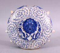 AN OTTOMAN TURKISH IZNIK STYLE POTTERY WATER FLASK, 21cm wide x 18cm high