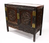 A LOVELY 19TH CENTURY CHINESE HARDWOOD / HONGMU CARVED DRAGON TWO-DOOR CABINET, the door panels