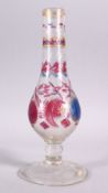 A 19TH CENTURY ISLAMIC TURKISH CUT GLASS HUQQA BASE, with floral decoration, 30cm high.