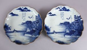 A PAIR OF JAPANESE MEIJI PERIOD BLUE & WHITE ARITA PORCELAIN DISHES, each decorated with native