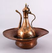 A 19TH CENTURY TURKISH OTTOMAN COPPER BASIN & EWER, The ewer with silver traces, 36cm high , the