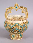 A ISLAMIC ZSLONAY OPENWORK PORCELAIN FORMED CASKET, with turquoise and gilded decoration, 18cm x