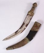 A 19TH CENTURY ISLAMIC ARABIC JAMBIYA DAGGER, with inset stones with a white metal and leather