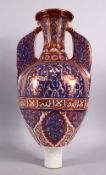 A 19TH CENTURY ISLAMIC SPANISH HISPANO - MORESQUE POTTERY TWIN HANDLE GAZELLE VASE, with a lustre