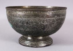 AN ISLAMIC PERSIAN SAFAVID OR LATER BRONZE BOWL, with carved hunting scenes, and flora, 12cm high