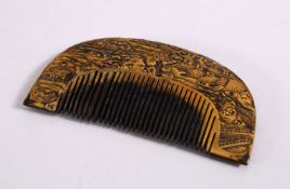 A JAPANESE MEIJI PERIOD GOLD LACQUER COMB, carved with temples and landscapes, 8.5cm