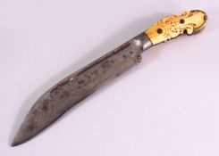 AN 18TH CENTURY SRI LANKAN CEYLONESE LARGE DAGGER, with a carved ivory / bone hilt, 32cm.